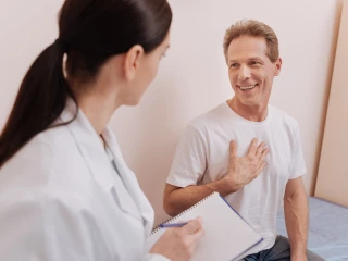 Emotional joyful patient telling his doctor good news