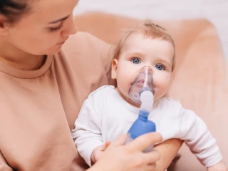 Little boy with inhalation mask (