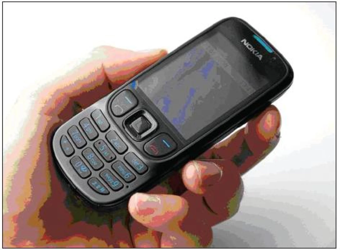 Použitý mobilní telefon ve studii.